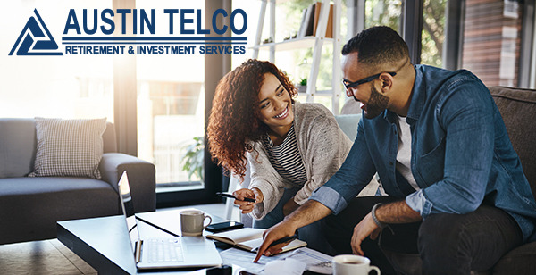Austin Telco Retirement & Investment Services - Couple sitting and doing finances.