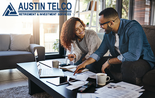Austin Telco Retirement & Investment Services - Couple sitting and doing finances.
