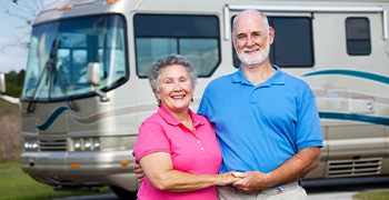 couple in front of rv