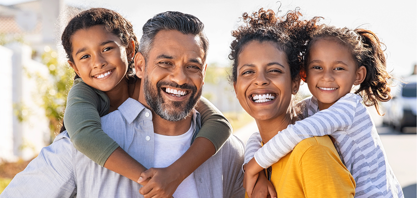 family smiling at camera