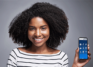 woman holding phone up with austin telco app on screen