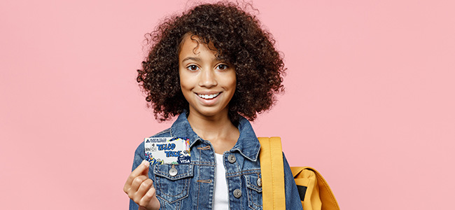 Young Girl Holding ATFCU True Youth Checking Account Debit Card