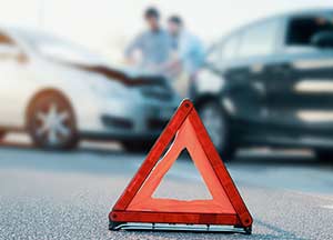 Hazard triangle on road before a wreck.