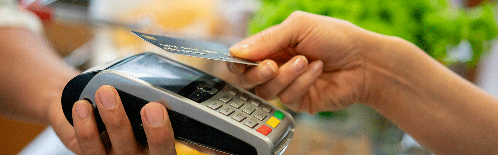 person using chip reader with their credit card