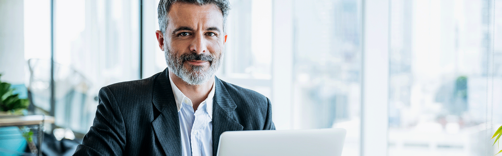 business man smiling while at computer