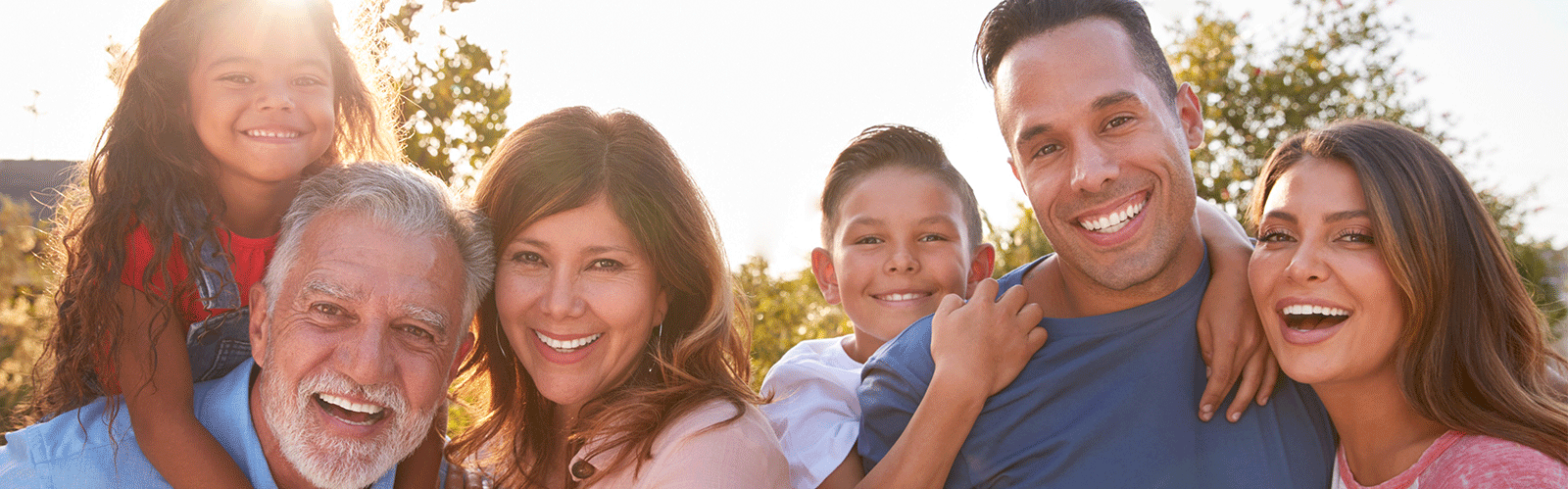 large family smiling at camera