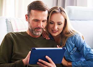 Couple looking at tablet