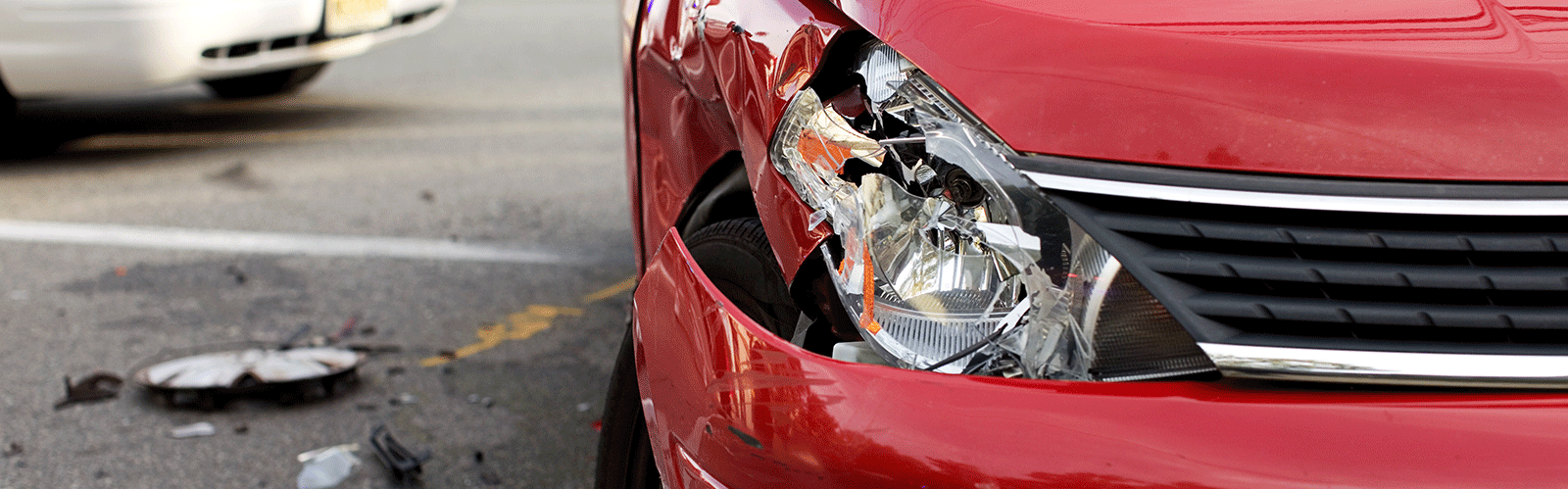 red car with broken light from crash