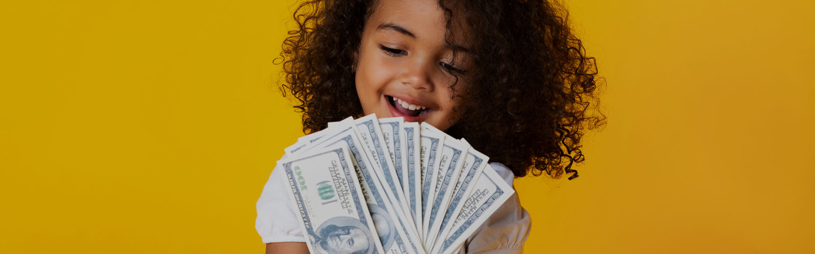 Young girl holding cash