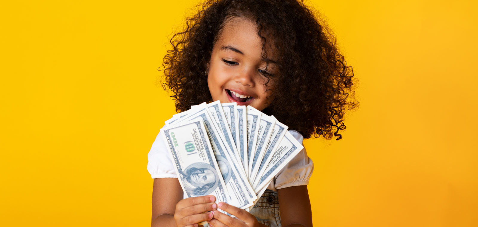 Young girl holding cash