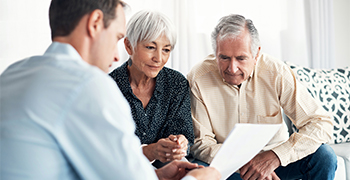 older couple talking to investor