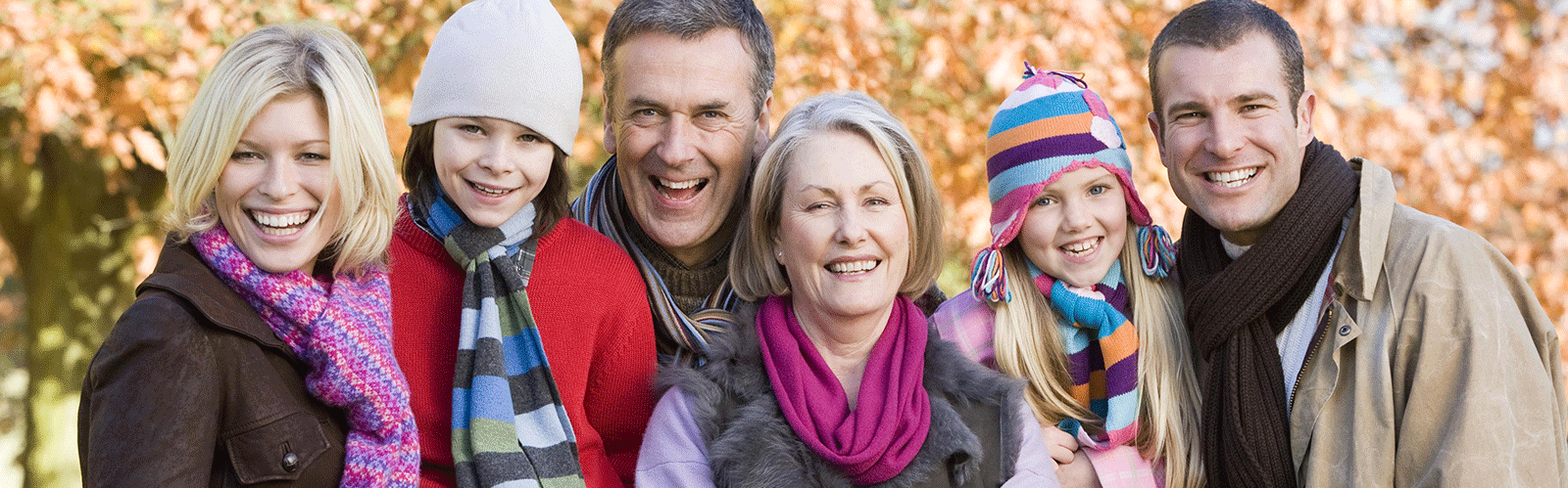 large family in jackets smiling at camera