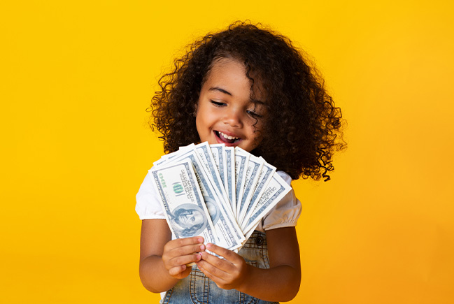 Young girl holding cash