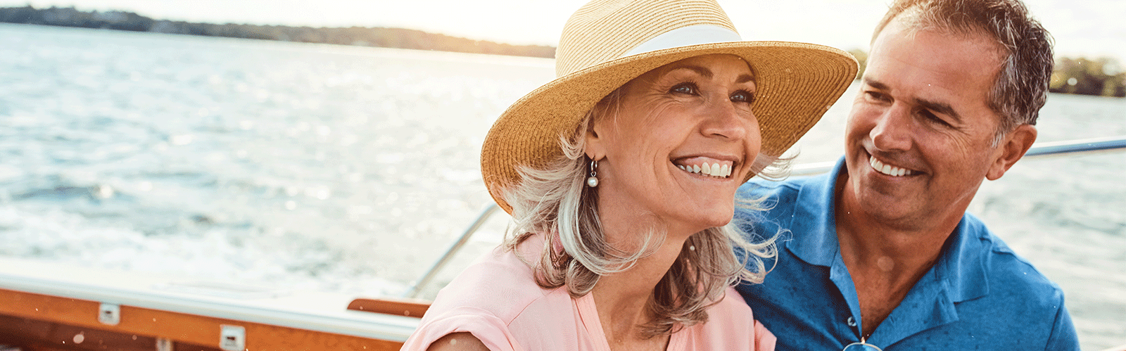 couple smiling while on a boat